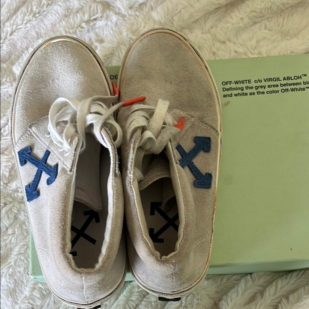 Off-White Cream and Blue Sneakers with Classic Design.